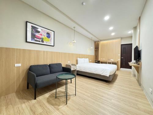 Un ou plusieurs lits dans un hébergement de l'établissement Yoshi Hotel - Tainan Sinmei Branch