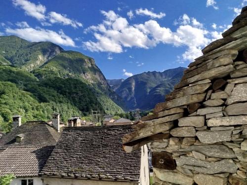 a view of mountains from the roofs of houses at Casa Coerente Cavergno - Room 2 in Cevio