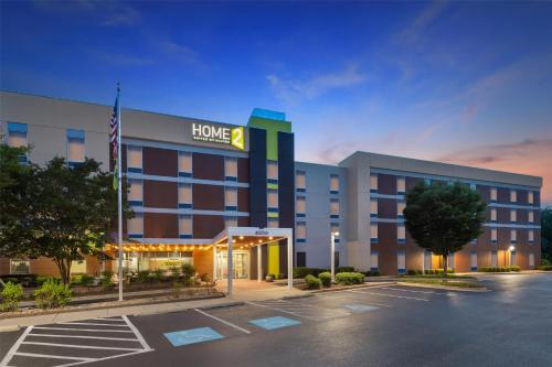 a hotel parking lot with at Home2 Suites by Hilton Lexington Park Patuxent River NAS, MD in Lexington Park