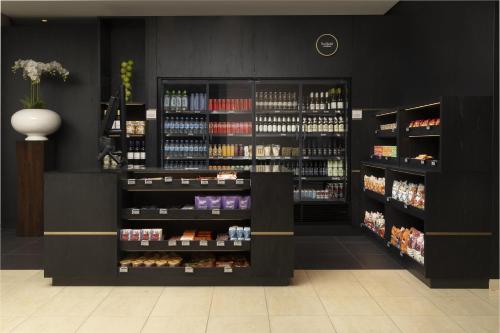 a store with a lot of bottles of wine at Hilton Düsseldorf in Düsseldorf
