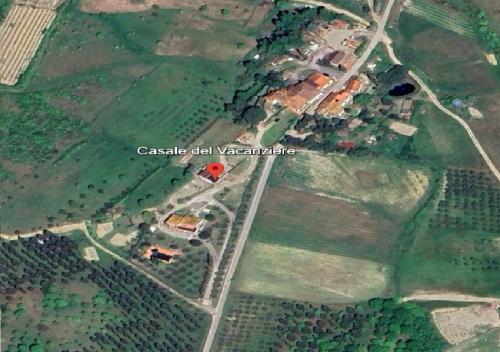 an overhead view of a field with houses and trees at Casale del Vacanziere in Certaldo