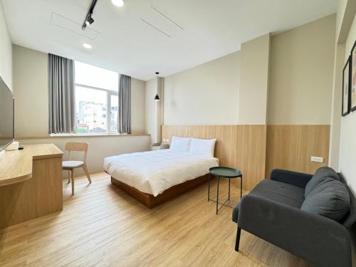 Giường trong phòng chung tại Yoshi Hotel Xinmei Street