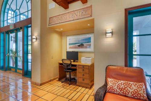 an office with a desk and a computer in a room at Quality Suites Downtown San Luis Obispo in San Luis Obispo