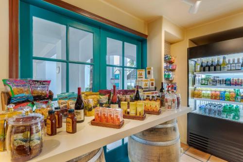 a counter with many bottles of alcohol on it at Quality Suites Downtown San Luis Obispo in San Luis Obispo