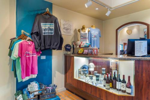 a shop with a display case with shirts and other merchandise at Quality Suites Downtown San Luis Obispo in San Luis Obispo
