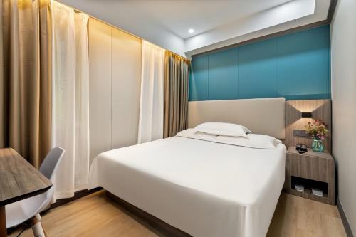 Cama o camas de una habitación en Xiangshang Hotel&Canton Fair Shuttle Bus