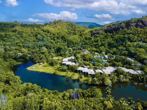 an aerial view of a resort in the middle of a lake at Kempinski Seychelles Resort in Baie Lazare Mahé