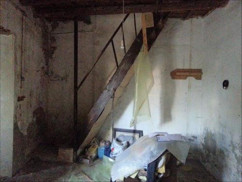 an attic room with a staircase in a house at Villa GIANNAKOS MINOAN HERSONISSOS in Kastéllion