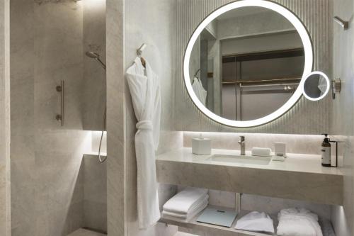 a bathroom with a sink and a mirror at Hyatt Regency Izmir IstinyePark in Izmir