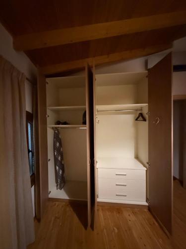 a room with a closet with white cabinets at Villa GIANNAKOS MINOAN HERSONISSOS in Kastéllion