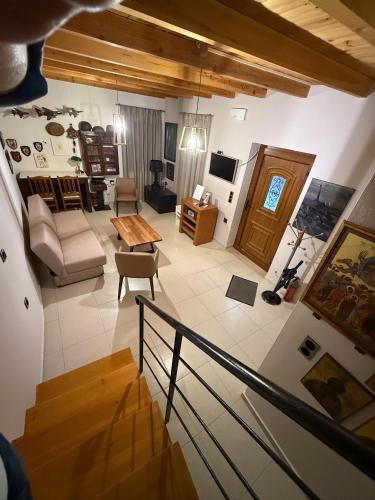a living room with a couch and a table at Villa GIANNAKOS MINOAN HERSONISSOS in Kastéllion