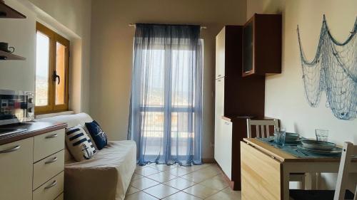 Kuchyň nebo kuchyňský kout v ubytování Azzurro Apartman