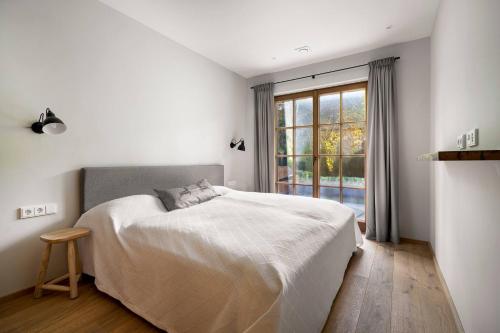 Ένα ή περισσότερα κρεβάτια σε δωμάτιο στο Garten Suite Kirchberg by Alpine Host Helpers