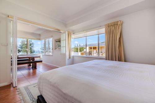 Postel nebo postele na pokoji v ubytování The Oceanside Stay by the BnB Collection