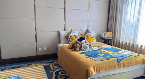 a childs bedroom with a bed with stuffed animals on it at Hohhot Inner Mongolia Hotel in Hohhot