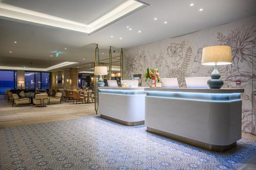 a lobby of a hotel with a reception desk at Amadria Park Grand Hotel 4 Opatijska Cvijeta in Opatija