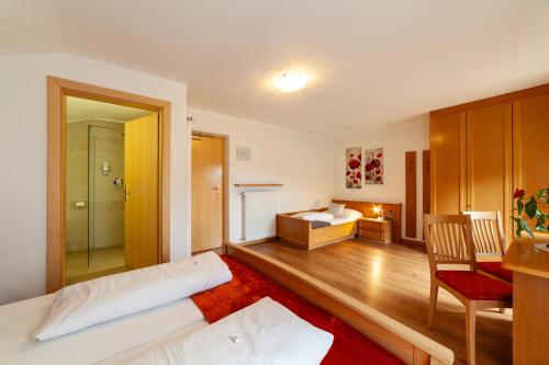 Postel nebo postele na pokoji v ubytování Almhotel Bergerhof