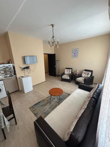 a living room with a couch and a table at Apartment near Tskaltubo spa restort in Tskaltubo