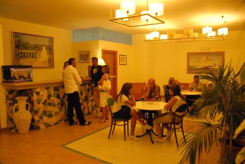 a group of people standing in a room at Park Hotel Villa Americana in Rodi Garganico