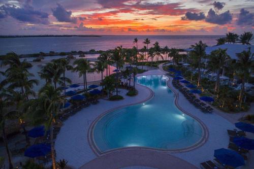 an aerial view of a resort swimming pool at sunset at Hawks Cay Resort in Marathon