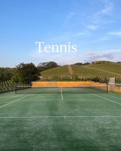 a tennis court with a tennis racket on it at Casa Visette in Monforte dʼAlba