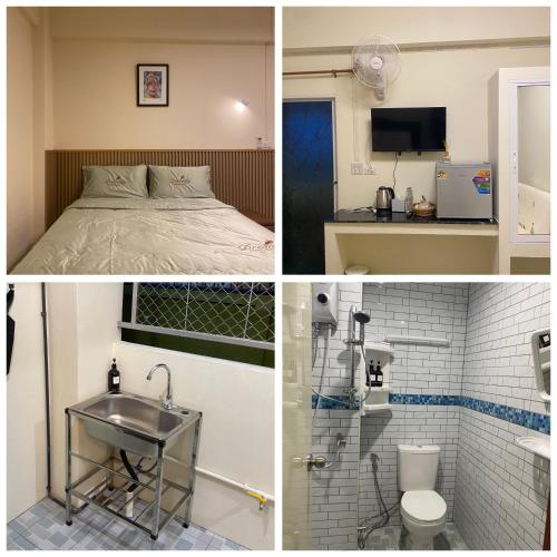 a room with a bed and a sink and a bathroom at Boontorsub in Ban Khlong Samrong
