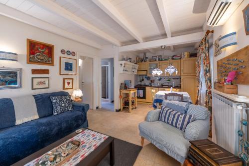 a living room with a couch and a table at Villa Valentina in Levanto