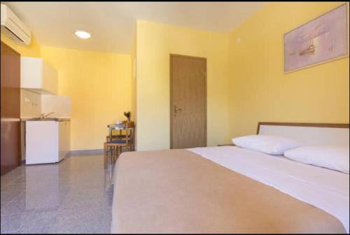 Ένα ή περισσότερα κρεβάτια σε δωμάτιο στο Triglav Studio Apartments