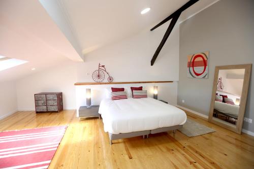 a bedroom with a bed and a bicycle on the wall at Enjoy Lisbon Alfama 2 in Lisbon