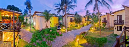 an aerial view of a street with houses and trees at Serhs Villas Da Pipa Hotel in Pipa