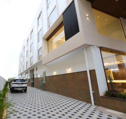 a car parked in front of a building at Hotel Thirumala in Rāmeswaram