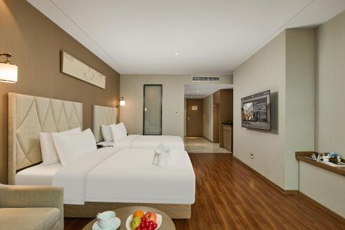 TV a/nebo společenská místnost v ubytování ARULA Youngor Central Hotel-Suzhou Guanqian St