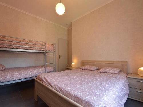 a bedroom with two bunk beds in a room at Attractive Apartment in Zell near River in Zell an der Mosel