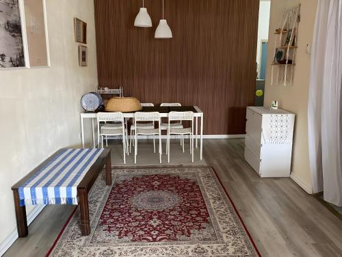 a dining room with a table and chairs at Yatie House in Melaka