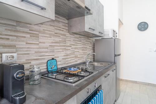 Kuchyň nebo kuchyňský kout v ubytování Le Quattro Perle Apartments