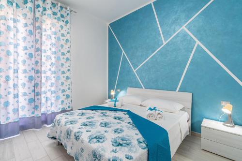 Postel nebo postele na pokoji v ubytování Le Quattro Perle Apartments