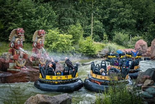 a group of people riding on rafts in a river at ibis Tilburg in Tilburg