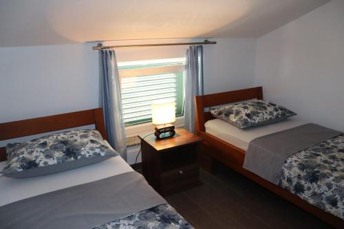 Postel nebo postele na pokoji v ubytování Villa Luce Apartment House