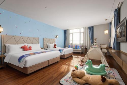 Postel nebo postele na pokoji v ubytování ARULA Youngor Central Hotel-Suzhou Guanqian St