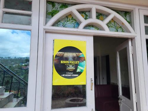 a sign on the door of a building at Bison Valley View Stay in Kodaikānāl