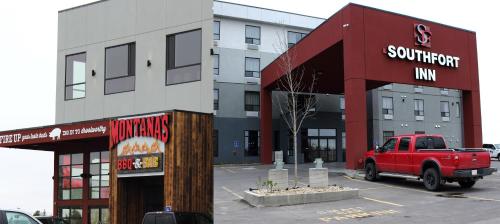 a red truck parked in front of a building at Southfort Inn in Fort Saskatchewan