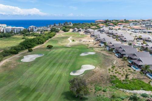 an aerial view of a golf course at a resort at Villa Jazmyn 15 Blue Bay Beach with Private pool in Sint Michiel