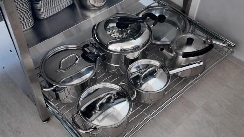 a bunch of pots and pans sitting in a dish rack at SunVILLA EASTEND in Choshi