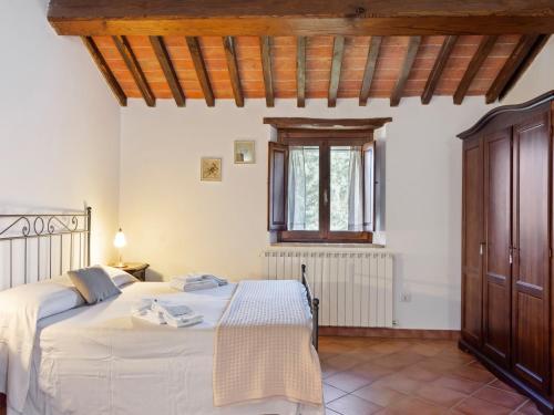 a bedroom with two beds and a window at Modern Holiday Home in Pietrafitta Umbria with Garden in Pietrafitta