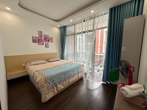 Кровать или кровати в номере Rose house