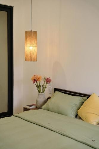 Ένα ή περισσότερα κρεβάτια σε δωμάτιο στο Lancelynk Homestay Danang