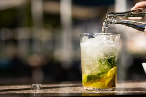 a drink is being poured into a glass at Cullera Holiday in Cullera