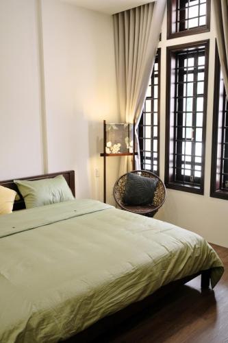 Ένα ή περισσότερα κρεβάτια σε δωμάτιο στο Lancelynk Homestay Danang