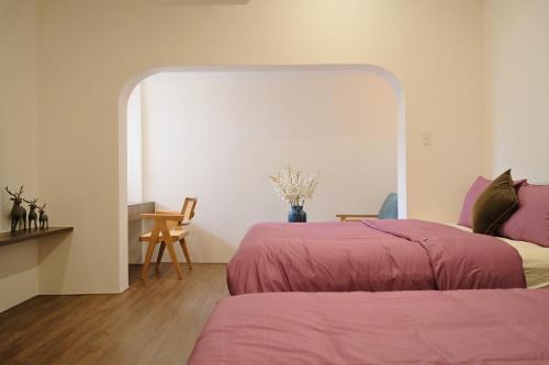 Ένα ή περισσότερα κρεβάτια σε δωμάτιο στο Lancelynk Homestay Danang