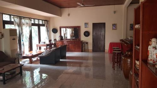 a living room with a couch and a table at Danoopa homestay in Savannakhet